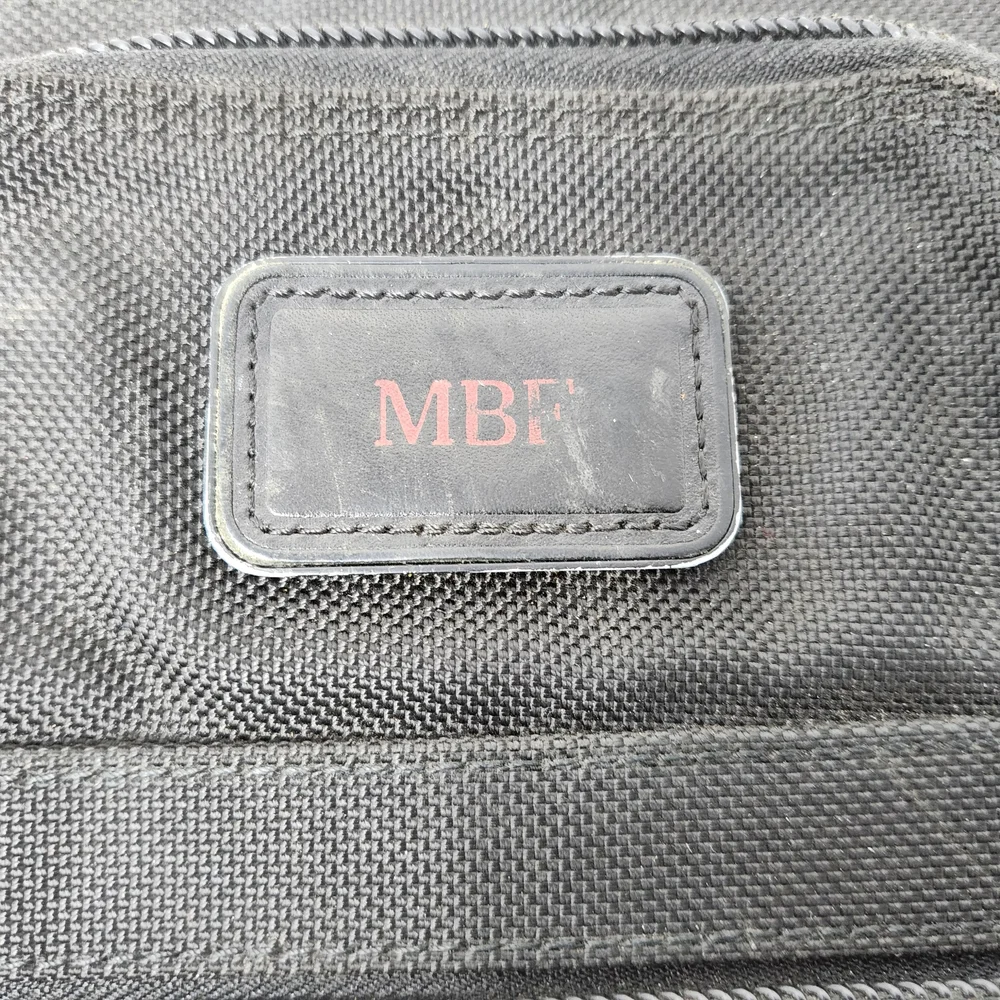 TUMI Black Briefcase with Durable Design